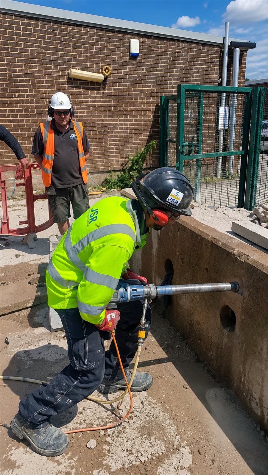 JSR Contracts Limited team breaking out concrete at the former Carpetright, Feltham